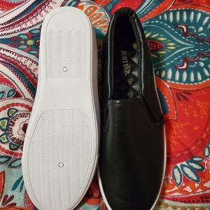 Black leather Just Fab slip ons